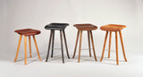 Tractor Seat Stools with machined Ash wood legs and leather seats by Enrico Bartolini
