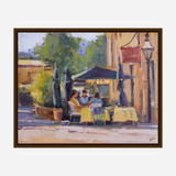 Impressionist-style painting of three people seated at a yellow-clothed table under dark green umbrellas outside a cafe, with warm beige buildings and a vintage street lamp nearby.