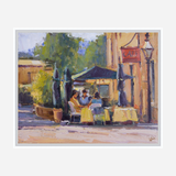 Impressionist painting of three people seated at an outdoor cafe with yellow tablecloths, green umbrellas, and a rustic lamppost on a sunny street corner.