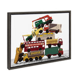 Framed canvas art showing a vibrant pile of vintage matchbox work vehicles stacked vertically