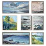 Seven framed landscape paintings with ocean, sky, clouds, trees, rocks, and hills in soft blues, greens, and earthy tones arranged in a gallery wall layout.