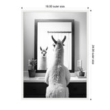 Black and white photo of a llama facing a bathroom mirror reflecting its front, flanked by two small potted plants on the countertop below the mirror.