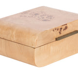 Square wooden stacking box with light natural wood grain and distinct dark burl patterns, featuring a slim horizontal metal handle on the front edge.