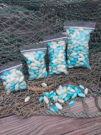 Bulk pastel dyed bubble shells in soft pink, blue, seafoam green, and yellow shades for crafting and DIY projects