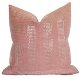 Red and ivory embroidered Pastiche Pillow Cover resting on a sofa showing textured pattern and linen back