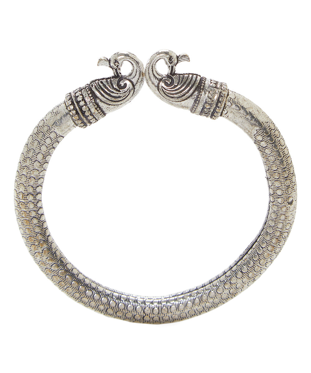 Close-up image of Antique Norse Peacock Head Viking Bracelet showing detailed dotted pattern and peacock heads.