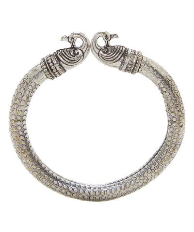 Close-up image of Antique Norse Peacock Head Viking Bracelet showing detailed dotted pattern and peacock heads.