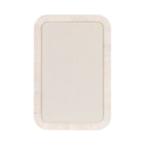 Rectangular pinboard with cream fabric surface framed by a light wood frame featuring rounded corners and subtle grain texture