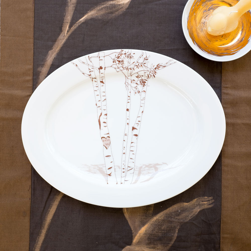 Ceramic oval platter with hand-drawn birch tree design and custom initials in heart engraving