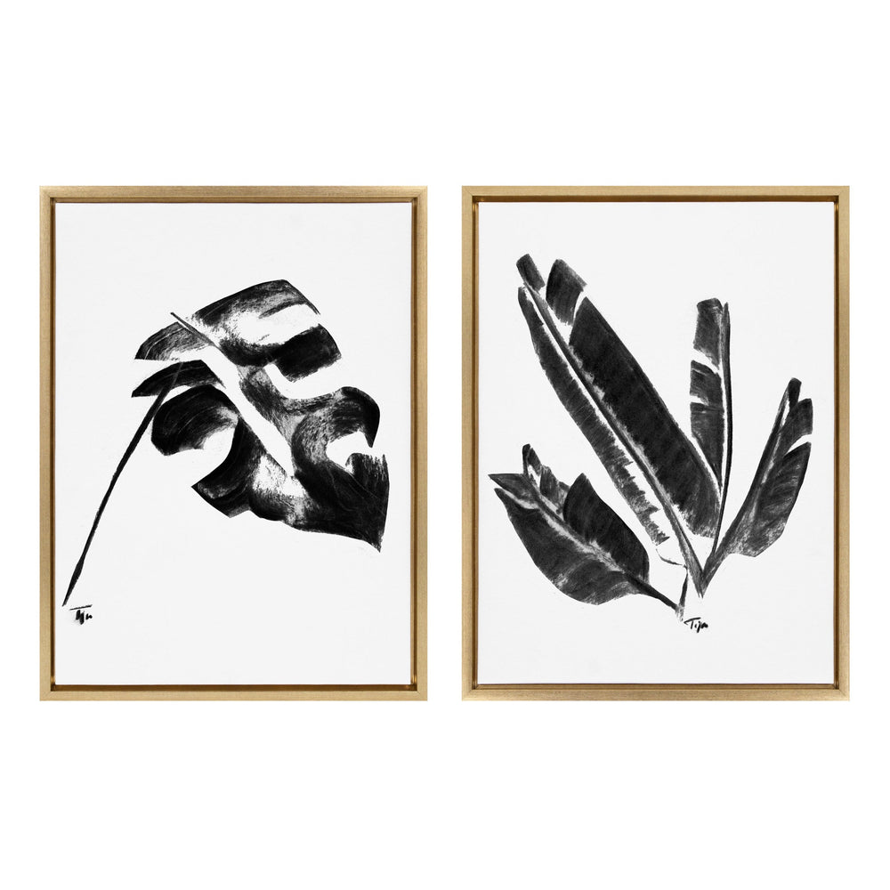 Two framed black and white botanical prints featuring a Monstera leaf on the left and elongated Banana leaves on the right, each with a wooden frame and signature marks.