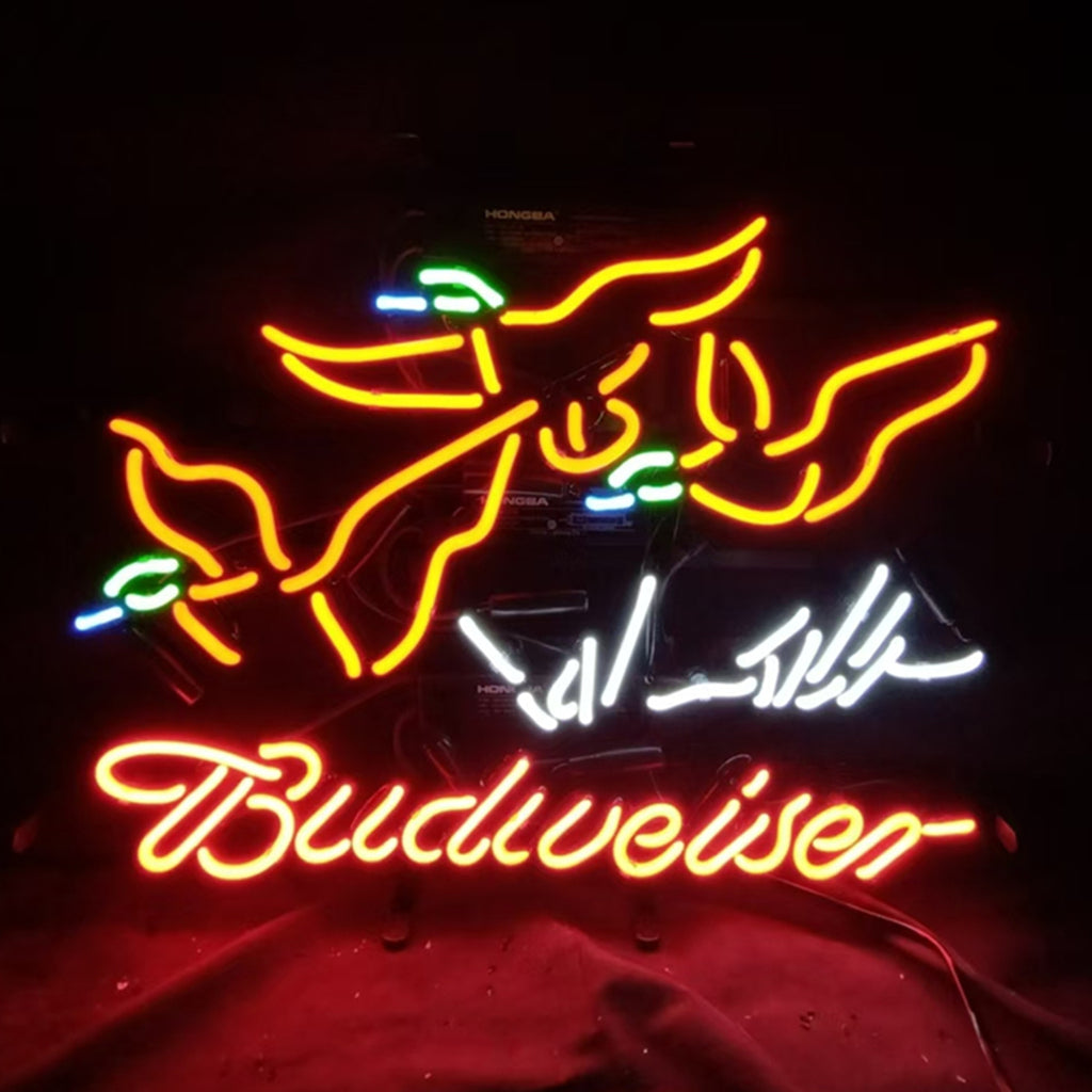 Neon sign with two orange flying ducks featuring green and blue accents above cursive red Budweiser text on a dark background.