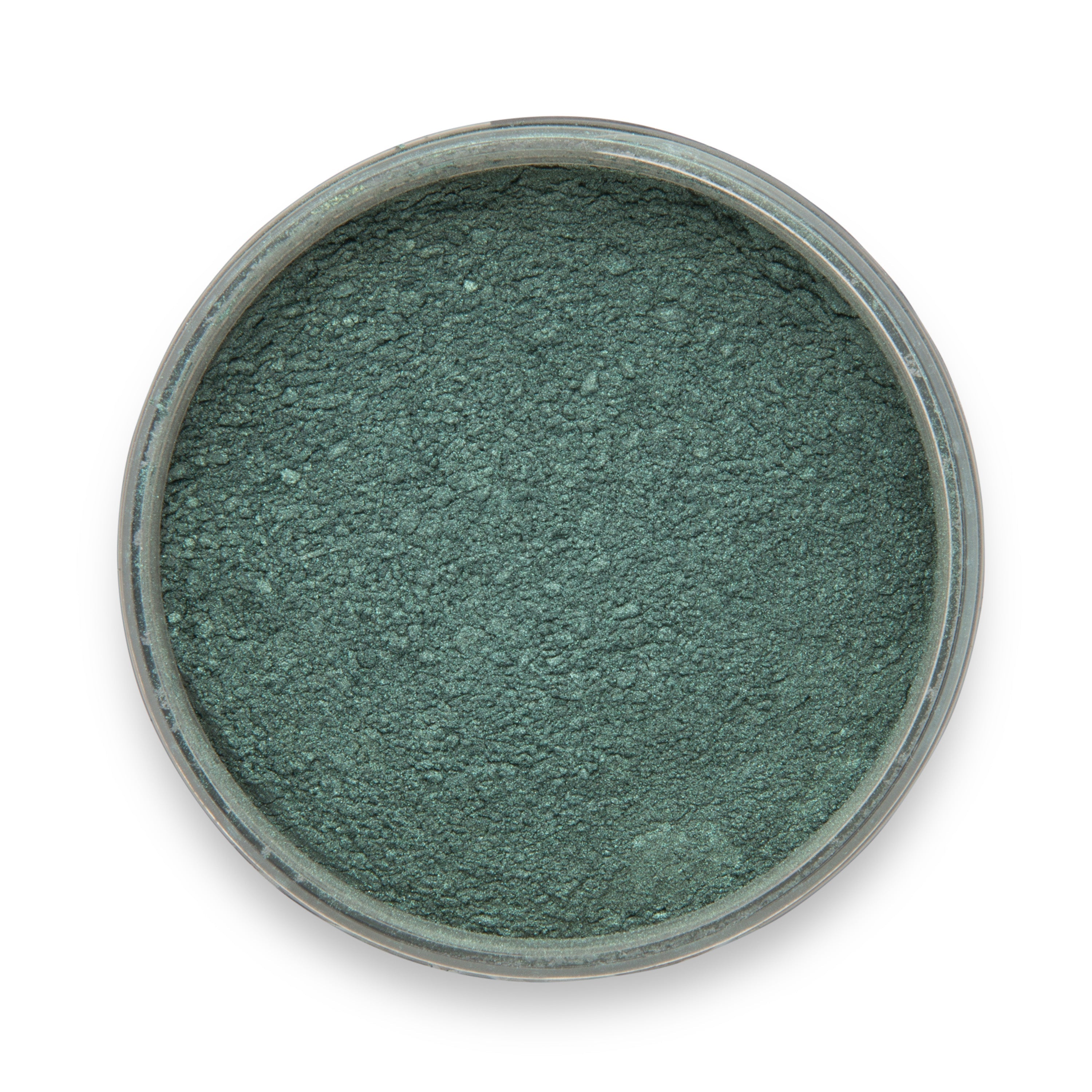 Green powder in a small container on a white background
