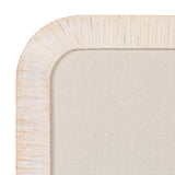 Close-up of a corner of a beige fabric pinboard with a textured pale wood frame featuring carved vertical grooves and a rounded corner.