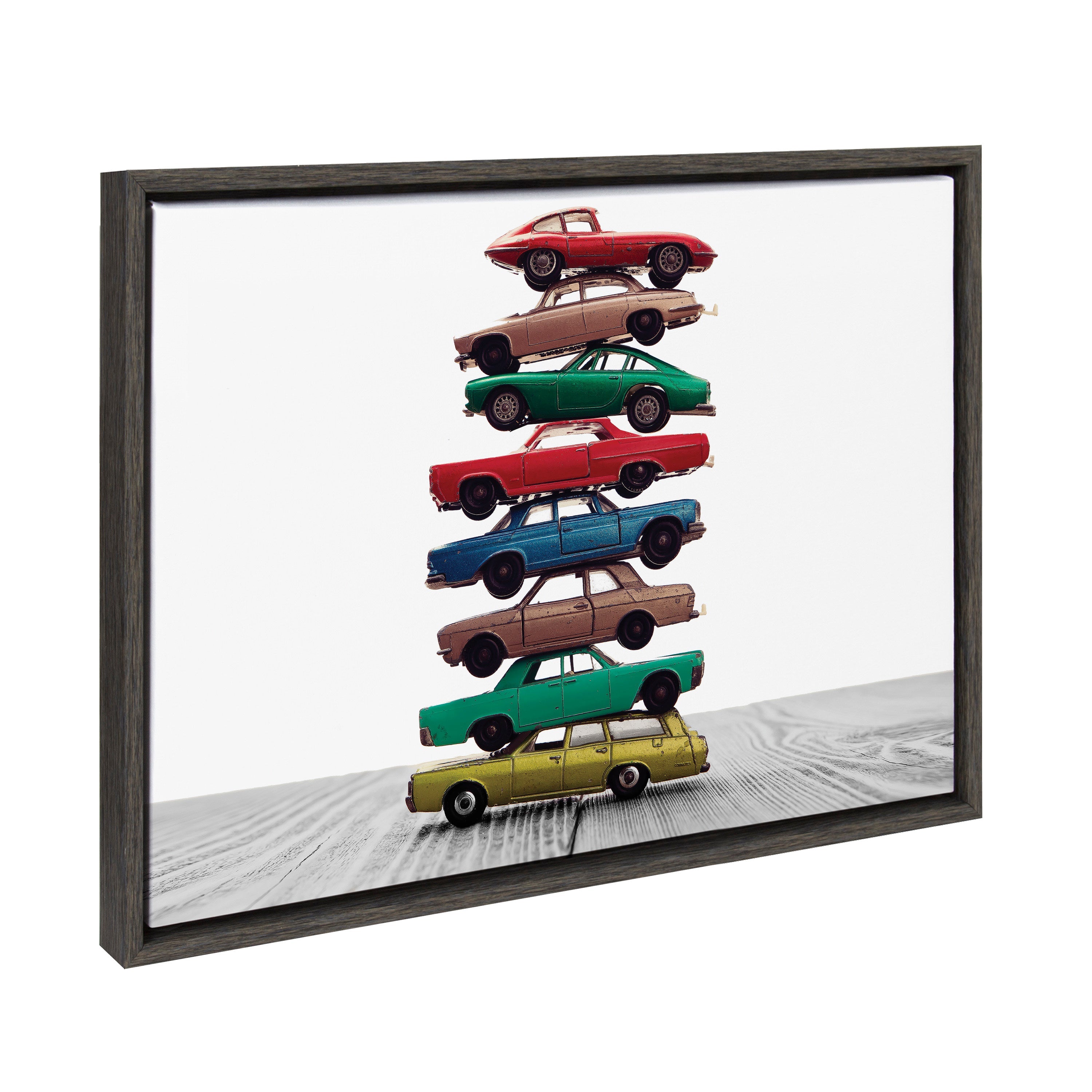 Framed canvas art titled Sylvie Stacked Cars featuring colorful toy cars stacked, with a floating lightweight frame