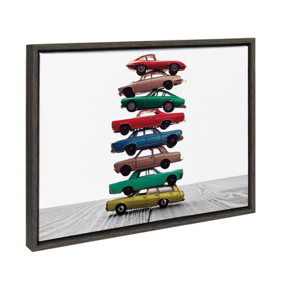 Framed canvas art titled Sylvie Stacked Cars featuring colorful toy cars stacked, with a floating lightweight frame