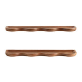 Two curved wooden shelves with smooth, wave-like carved fronts in a warm brown finish, shown against a white background.