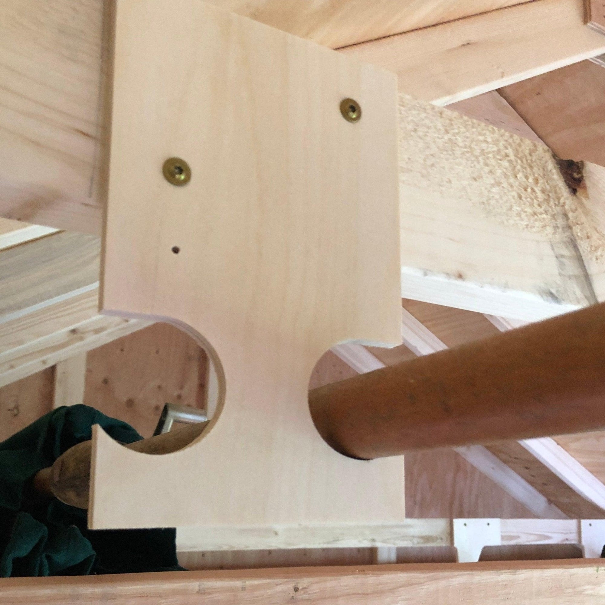 Pole Saw & Pool Skimmers Organizer Hooks mounted on a shed wall holding several long garden tools