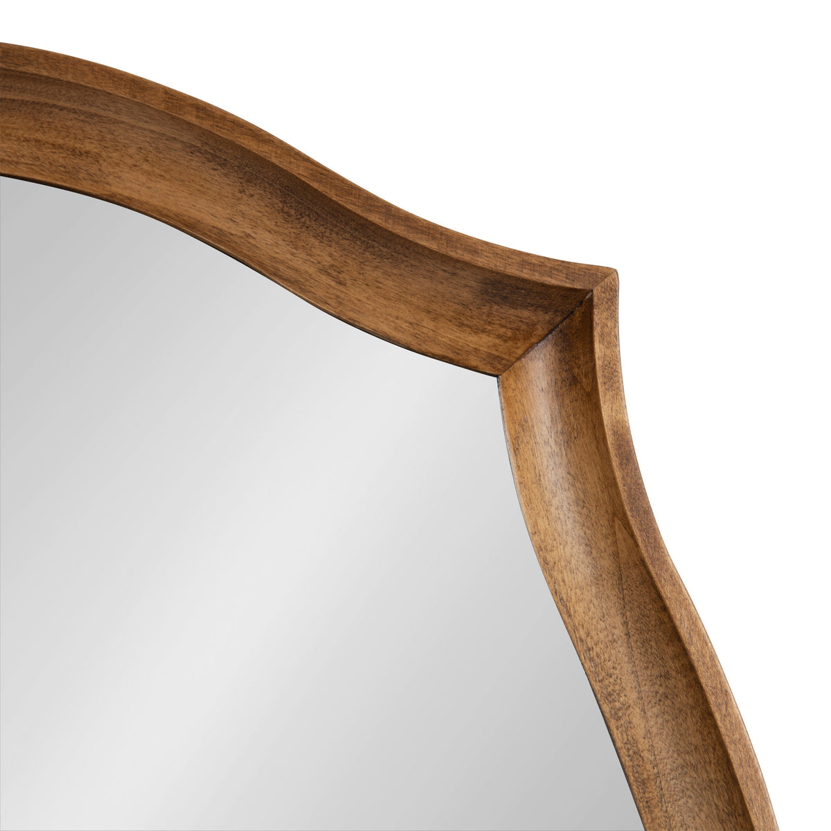 Close-up of the Hatherleigh Scallop Wall Mirror's chamfered, warm-toned wooden frame with a gently scalloped edge and smooth finish on a white background.