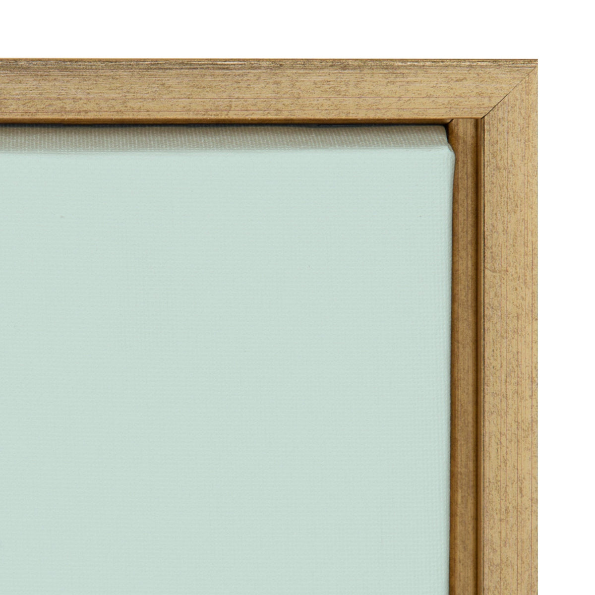 Close-up of a light wood corner frame enclosing a pale blue canvas with visible fabric texture.