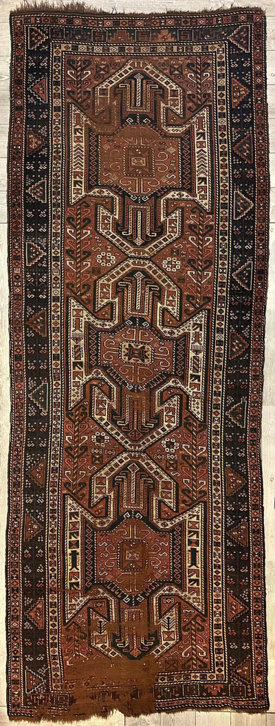 Photographs of the Pre-1900 Triple Shield Sewan Kazak rug showing detailed patterns in red, blue, and beige tones.