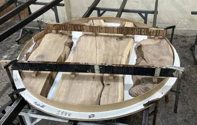 Round epoxy resin dining table with walnut wooden vortex base