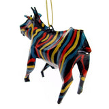 Three-dimensional hanging zebra ornament with colorful hand-painted stripes in red, blue, yellow, and black, shown against a white background.