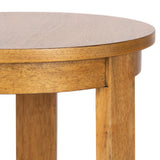 Close-up of a round wooden side table with a smooth light brown finish, showcasing its thick tabletop and sturdy square legs with visible grain texture.