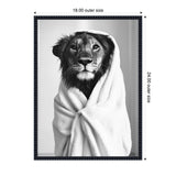 Black and white portrait of a lioness wrapped snugly in a soft towel, framed with a dark textured border and measurements displayed on sides.
