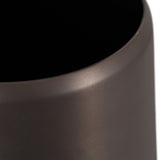 Close-up of the smooth, matte black curved edge of a cylindrical container or pot with a soft sheen on its surface