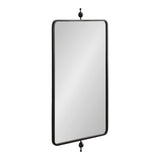 Tall rectangular mirror with rounded corners and thin black metal frame topped and bottomed by decorative metal finials