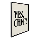Framed floating canvas art titled 'Yes Chef' by Saint and Sailor Studios shown hanging on a kitchen wall