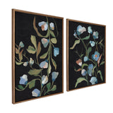 Two framed canvas paintings featuring delicate blue and white flowers with green leaves on a textured black background, displayed side by side at slight angles.