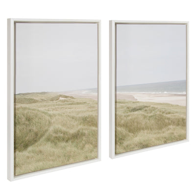 Two framed canvas art prints side by side showing peaceful coastal landscapes with ocean, shore and sky in soft tones