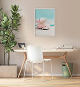 Framed canvas print of a pink vintage van on a sandy beach with a bouquet of pink flowers in the back, set against a blue sky and turquoise sea.