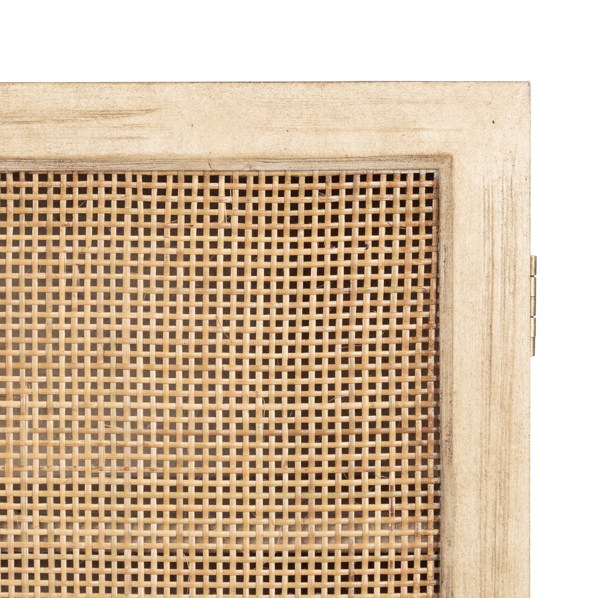 Close-up of the Ori Rattan wall cabinet door showing square woven rattan pattern framed by light distressed white wood with metal hinge on the right side.