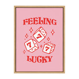 Framed pink canvas with bold red text 'FEELING LUCKY' surrounding three red dice each showing the number seven and small star shapes scattered around them.