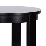 Close-up of a round black wooden side table showing its smooth tabletop edge and two straight legs against a white background