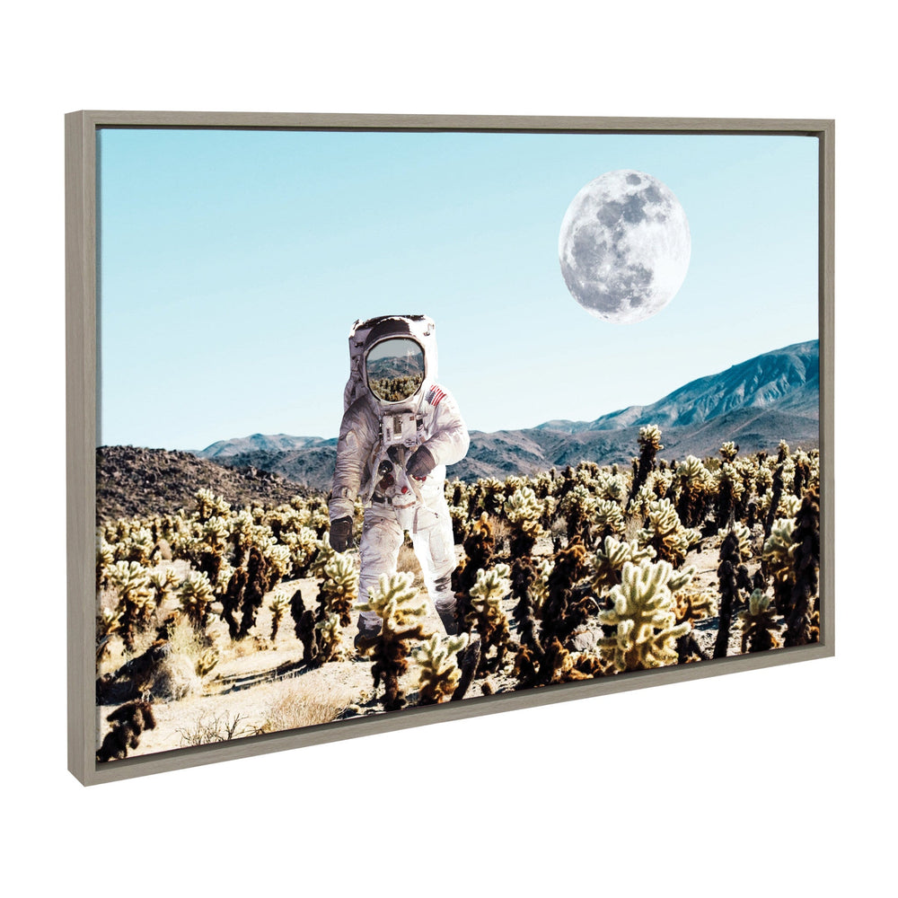 Framed canvas art of an astronaut exploring a desert moon landscape with gray tones