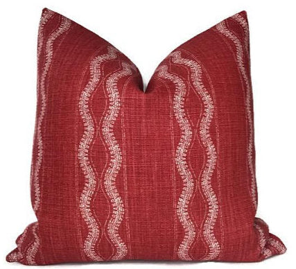 Zanzibar Pillow Cover in Red by Peter Dunham Textiles displayed on sofa