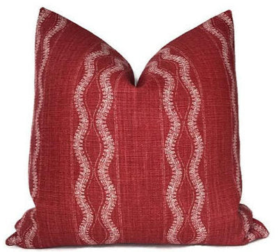 Zanzibar Pillow Cover in Red by Peter Dunham Textiles displayed on sofa