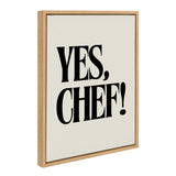 Canvas art with bold black text reading 'YES, CHEF!' centered on a cream background in a light wood frame viewed at an angle.