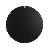 Back of a round wall mirror with black backing and metal hanging hardware, showing clips and wire attachments along the edge.