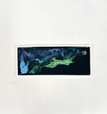 Rectangular resin ceramic tray with a blue and green abstract design on a white background