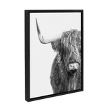 Black and white framed canvas featuring a close-up of a Highland cow with long shaggy hair covering its eyes and one visible curved horn.