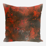 Square pillow with an abstract pattern blending deep reds and blacks with hints of white, creating a fiery, textured effect.