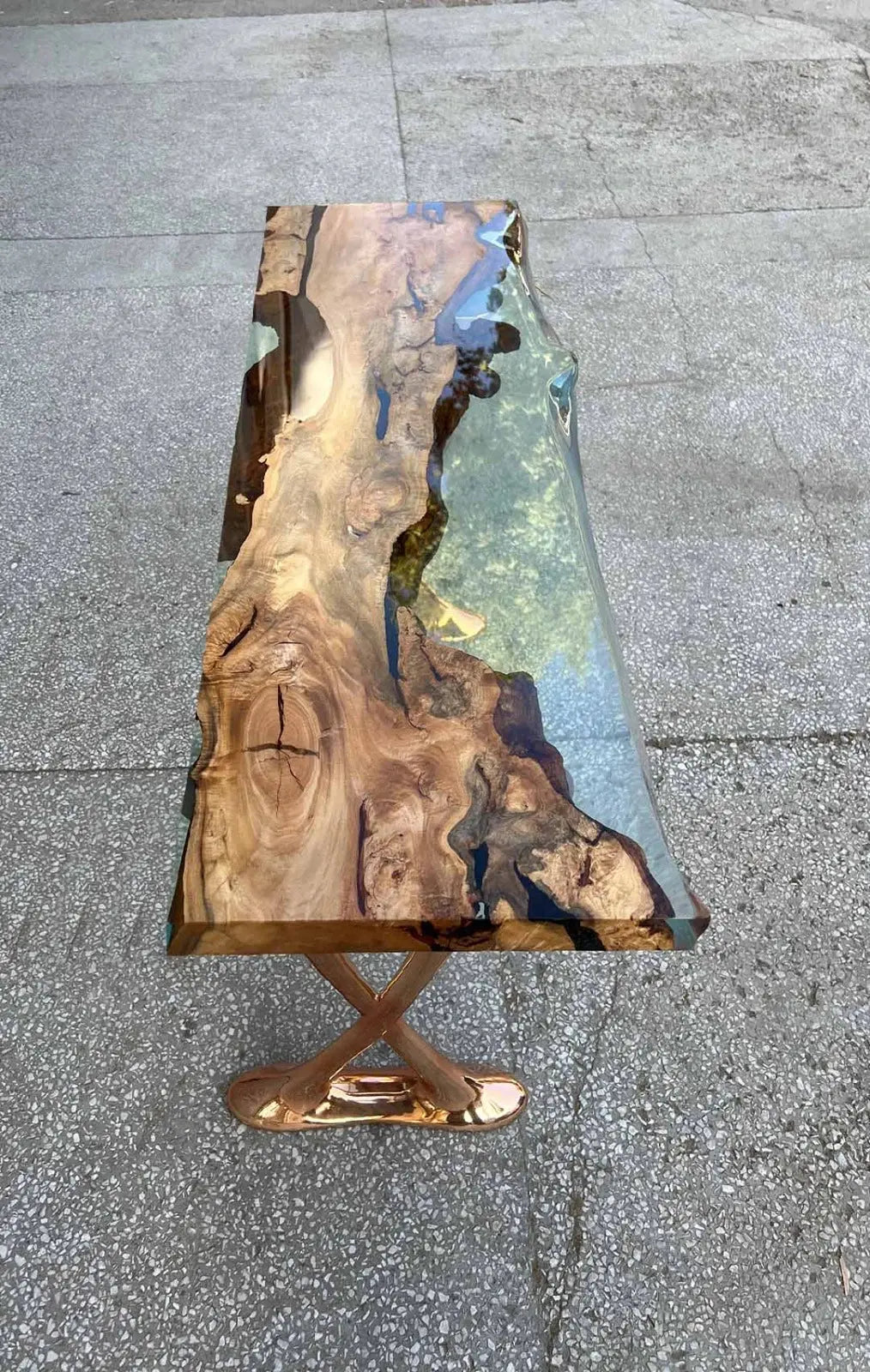 Handcrafted resin live edge console table made of aged linden wood with aluminum legs in a foyer setting