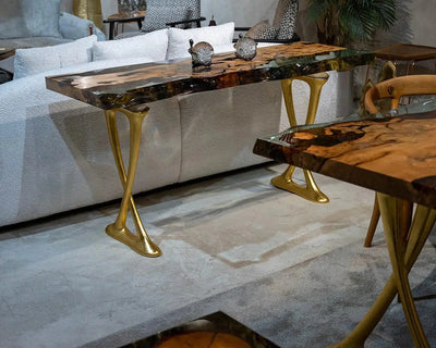 Handcrafted resin live edge console table made of aged linden wood with aluminum legs in a foyer setting