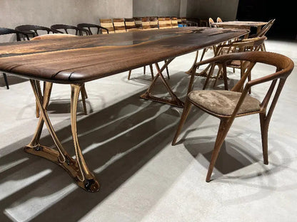 Custom epoxy resin dining room table with walnut wood and rose gold aluminum legs