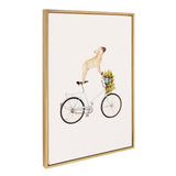 Framed canvas print of a light tan French Bulldog standing on the saddle of a white bicycle with a blue basket filled with yellow flowers, set against a plain white background.