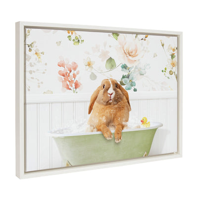 Framed canvas art showing a pudgy white bunny relaxing in a floral bubble bath.
